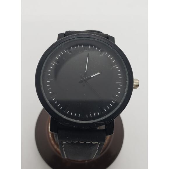 Men's dress watch. Large black face. Black adjustable band.